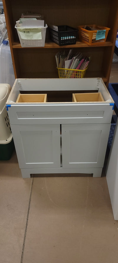 Dove Grey 30.25" Wide Vanity Base! (NEVER USED, BUT HAS DEFECT FROM SHIPPING)

-One drawer has a very small crack, photos shown.

-Also has a chip on the top front left drawer