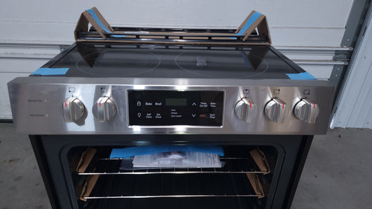 Frigidaire  30-in Smooth Surface 5 Elements 5-cu ft Self-Cleaning Freestanding Electric Range (Easycare Stainless Steel)!

-Brand new, has one very small indent on the bottom left side, photos shown