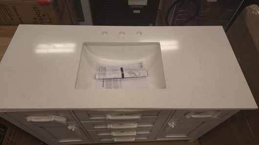 Riverdale 48 in. W x 21 in. D Vanity in Dove Grey with a Cultured Marble Vanity Top in White with White Sink! 

-Brand new out of the box ( Top of Vanity is Cracked - Photos shown - Price reduced for the crack)