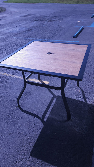 Black Square Metal Patio Outdoor Dining Table with 1.57" Umbrella Hole and Wood-Look Tabletop! (OUTDOOR TABLE SPECIAL!)

-New assembled out of the box but the wood top is cracked, photos shown