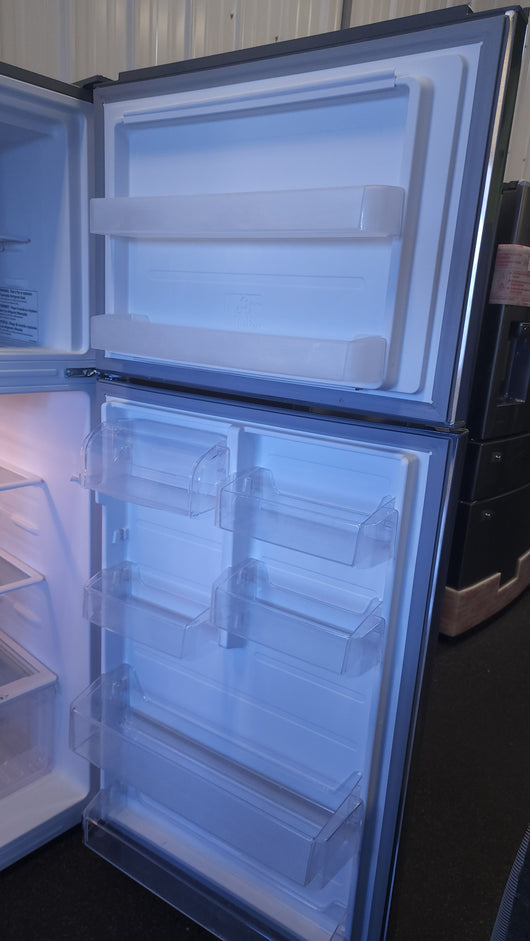 GE 18.3 cu. ft. Top-Freezer Refrigerator! (LIGHTLY USED)

-Lightly Used, very clean and works great (Does also gave a dent on the front face Door, photos shown)