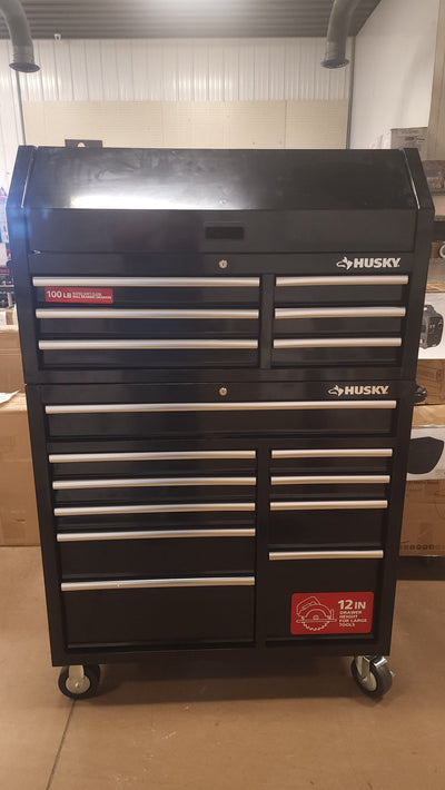 Husky 41 in. W x 24.5 in D Standard Duty 16-Drawer Combination Rolling Tool Chest and Top Tool Cabinet Set in Gloss Black!

-Brand new out of the box, does have one very small indent on the back left corner, photos shown
