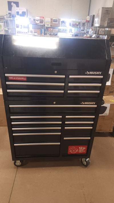 Husky 41 in. W x 24.5 in D Standard Duty 16-Drawer Combination Rolling Tool Chest and Top Tool Cabinet Set in Gloss Black!

-Brand new out of the box, does have one very small indent on the back left corner, photos shown