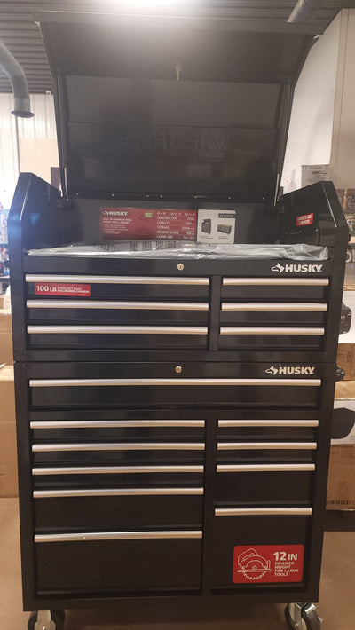 Husky 41 in. W x 24.5 in D Standard Duty 16-Drawer Combination Rolling Tool Chest and Top Tool Cabinet Set in Gloss Black!

-Brand new out of the box, does have one very small indent on the back left corner, photos shown