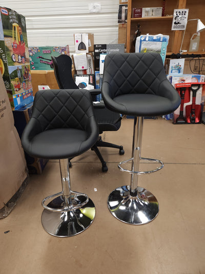 Set of 2 Faux Leather Adjustable Stools, Black!

-Brand new and Assembled, but one stool has a very small tear, photos shown