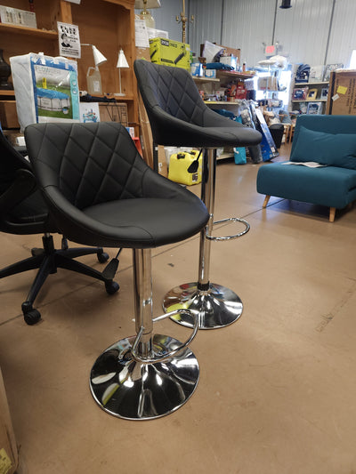 Set of 2 Faux Leather Adjustable Stools, Black!

-Brand new and Assembled, but one stool has a very small tear, photos shown