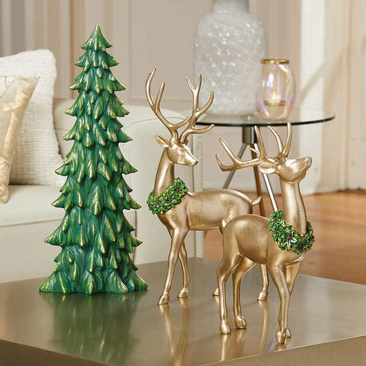 2 skillfully sculpted gold deer and a festive green tree that have been hand-painted - new in box