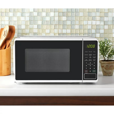 Mainstays 0.7 Cu ft Compact Countertop Microwave Oven, White**New in box**