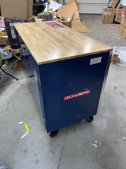 Husky 52 in. W x 24.5 in. D Standard Duty 10-Drawer Mobile Workbench Tool Chest with Solid Wood Work Top in Gloss Blue- brand new - has shipping dent at rear corner