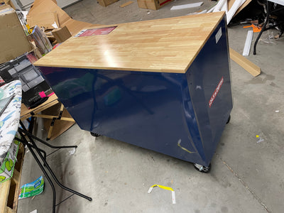 Husky 52 in. W x 24.5 in. D Standard Duty 10-Drawer Mobile Workbench Tool Chest with Solid Wood Work Top in Gloss Blue- brand new - has shipping dent at rear corner