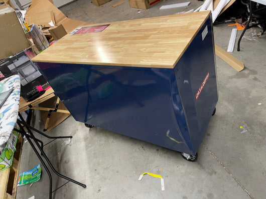 Husky 52 in. W x 24.5 in. D Standard Duty 10-Drawer Mobile Workbench Tool Chest with Solid Wood Work Top in Gloss Blue- brand new - has shipping dent at rear corner
